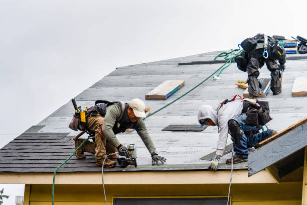 Professional Roofing technician working in Medway, MA